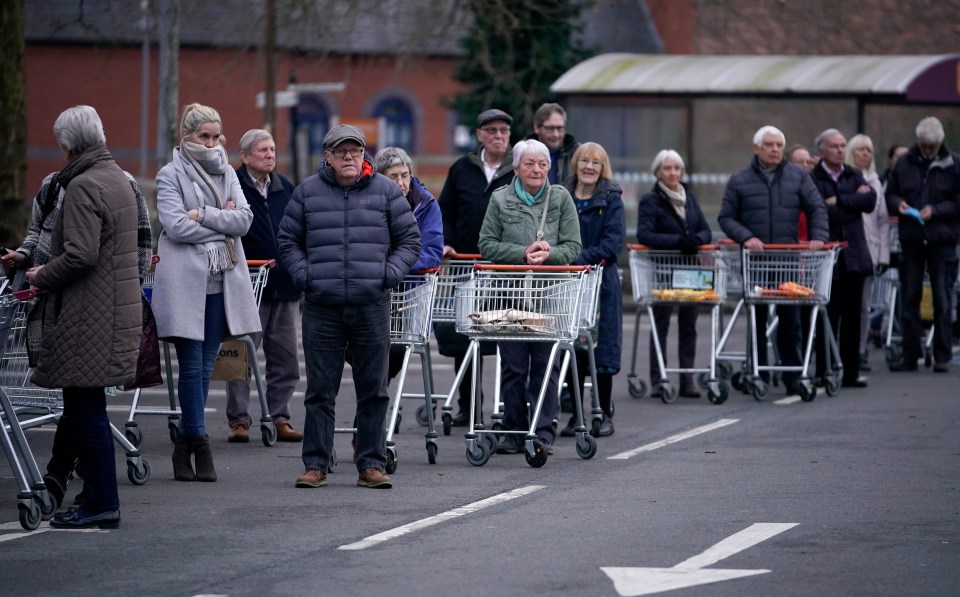 Senior citizens queue to shop at Sainsbury’s Supermarket in Northwich this morning