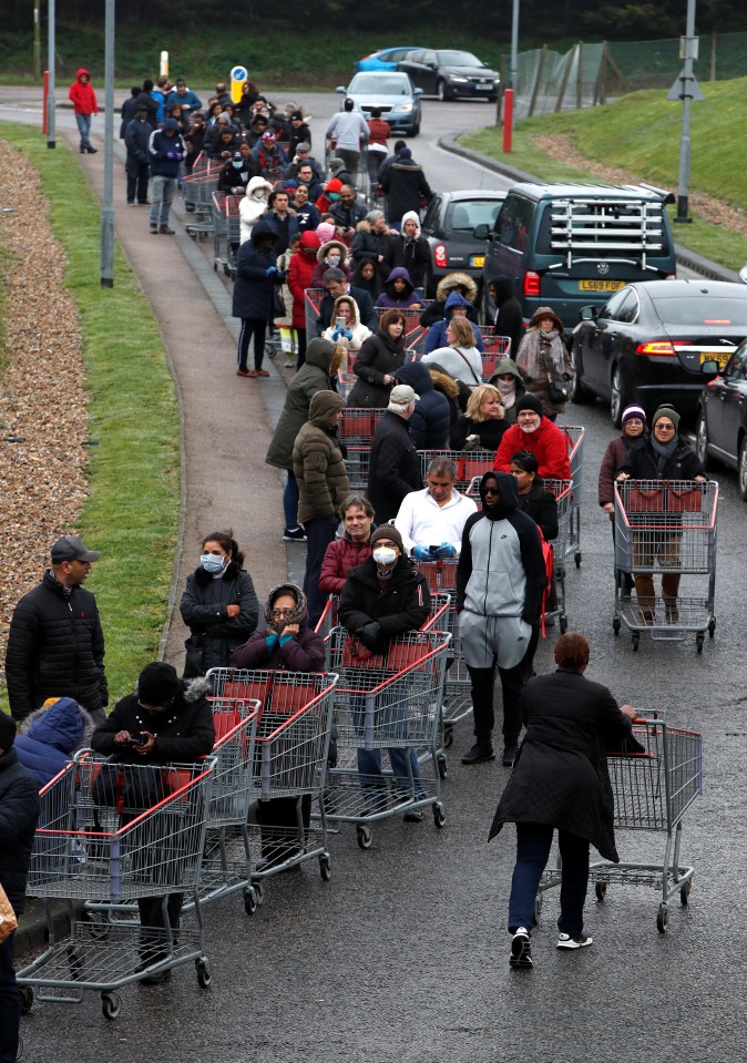  A huge queue snakes its way to the doors of Costco in Watford