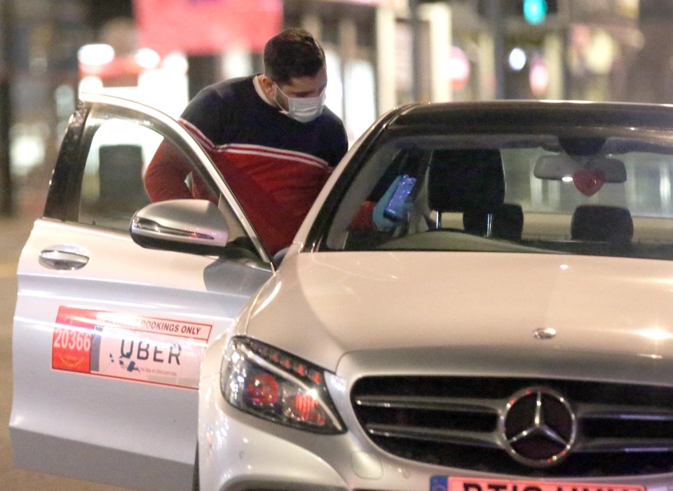  A reveller wears a face mask in Leeds