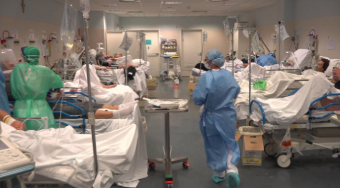  Patients are seen in a coronavirus ward in Bergamo, Lombardy, as Italy's death toll continued to rise