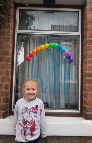  Families are being encouraged to tape hand-painted drawings of rainbows in their windows