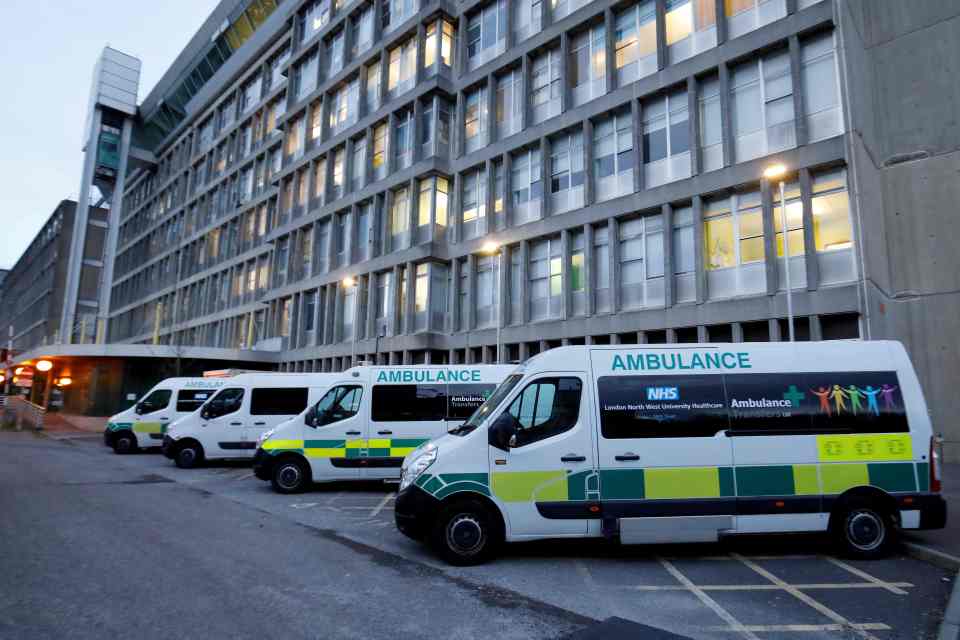  Ambulances are pictured outside Northwick Park Hospital in London tonight