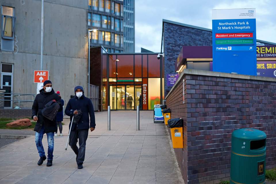  People wearing masks as a precautionary measure against covid-19, leave Northwick Park Hospital in London