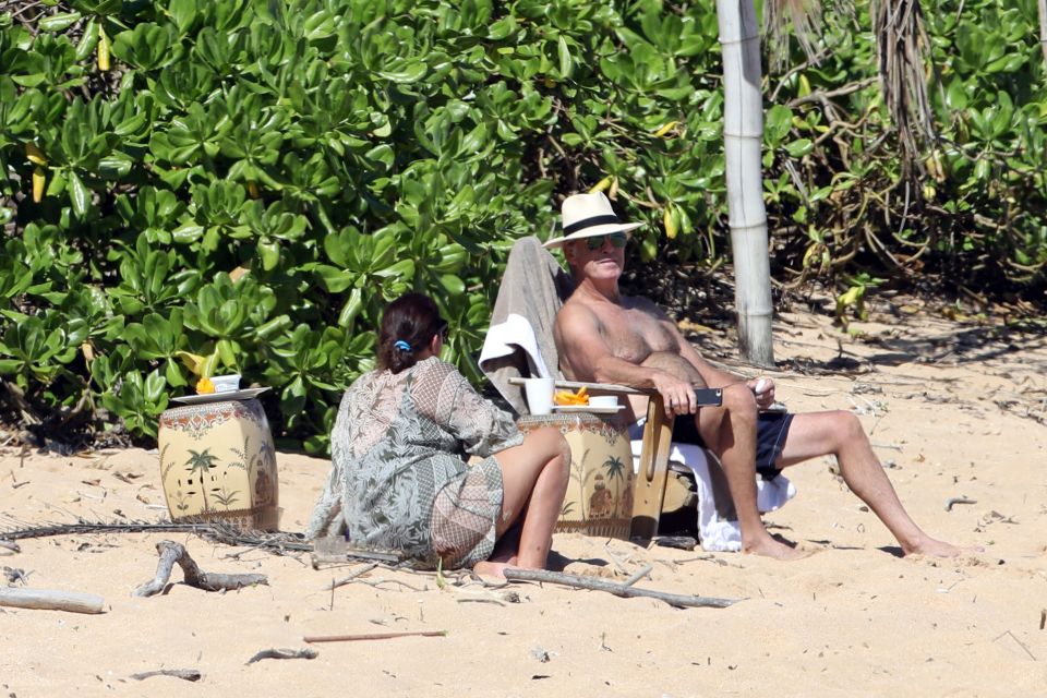  Pierce relaxed with wife Keely on the beach on holiday