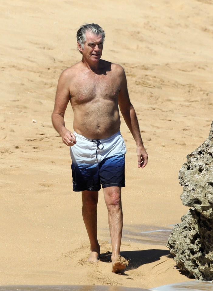  The 66-year-old enjoyed a beach stroll on holiday in Hawaii