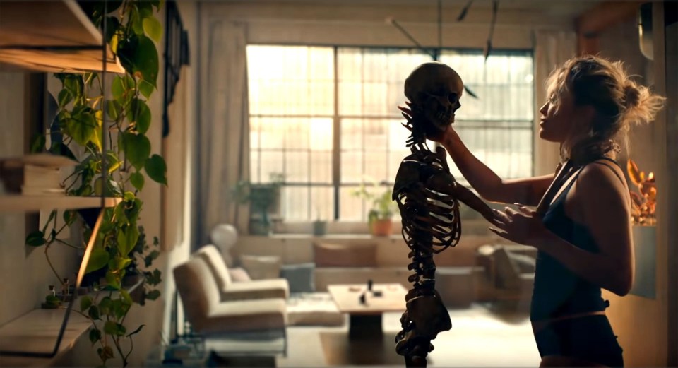  Rita is seen seducing a skeleton in her latest video