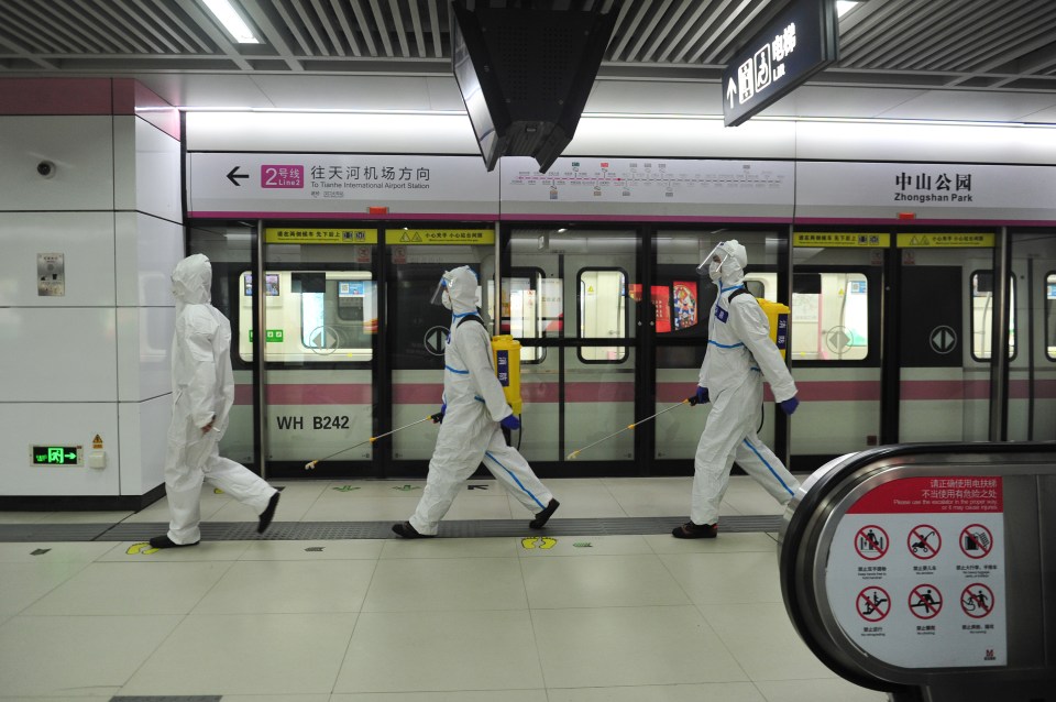 Workers disinfecting the public transport system as China prepares to fully reopen Wuhan