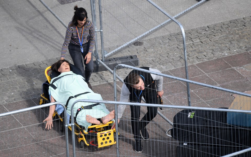  A dummy to help medics tackle the virus is wheeled into the new hospital