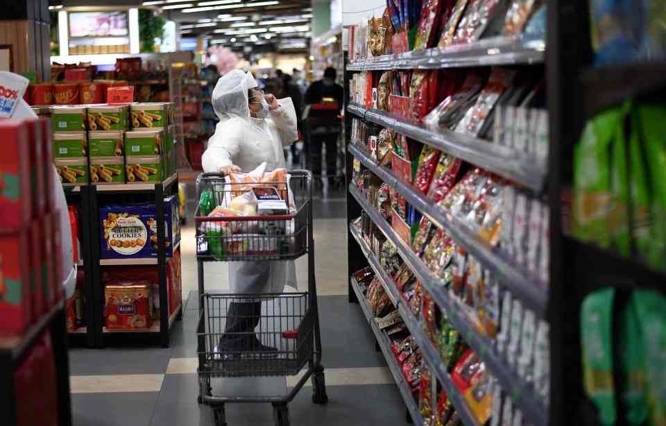  A shopper hits the stores in a full haz-mat suit