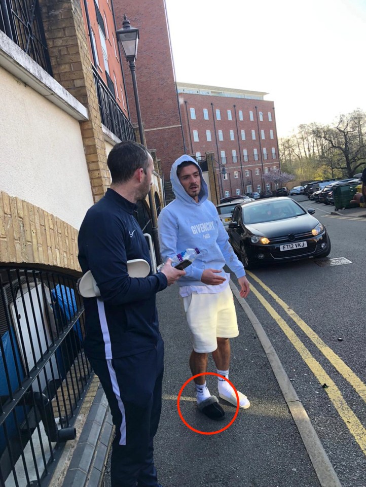 Grealish was pictured at the scene of the collision wearing two different slippers