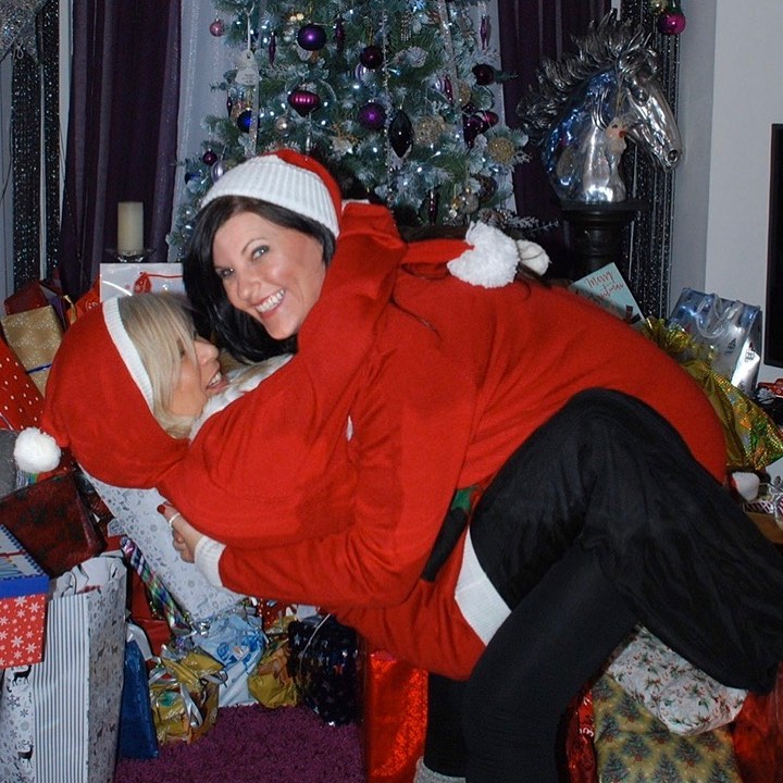  Sam and Linda messing around by the tree at Christmas