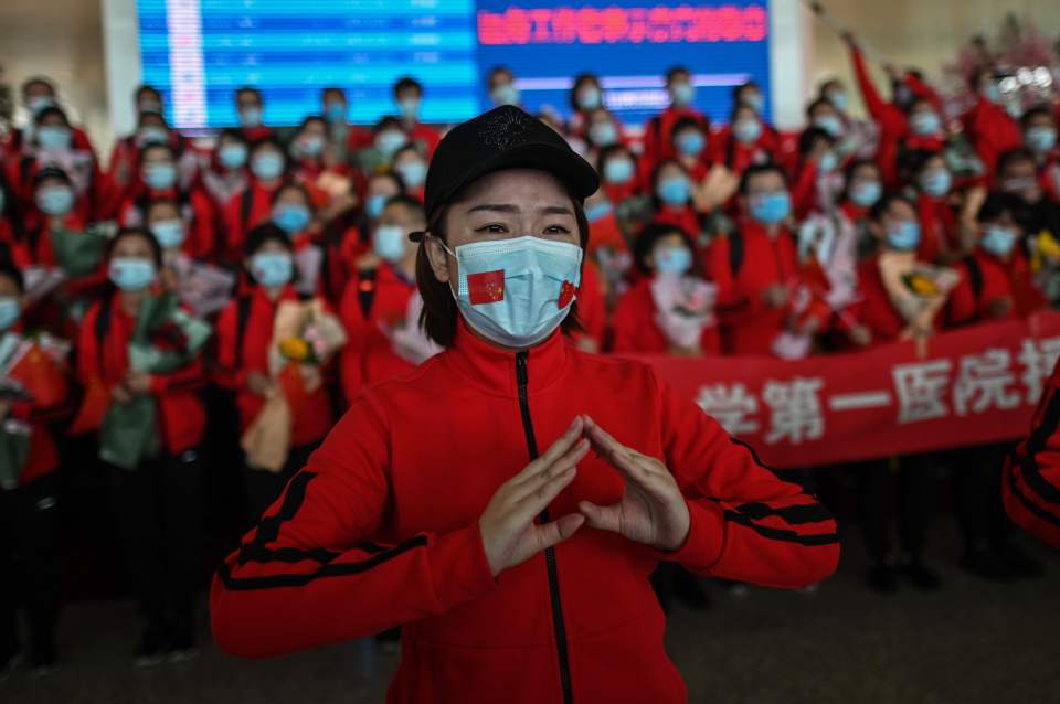  A medical staff member from Jilin Province tears up during a ceremony as Tianhe Airport is finally reopened in Wuhan on April 8