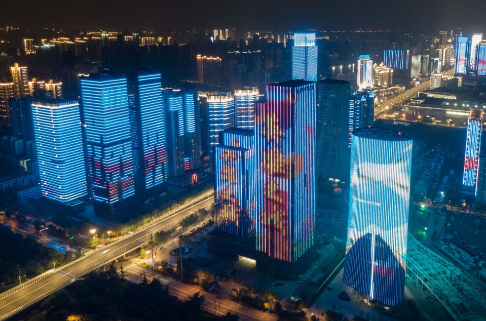  Aerial photo taken on April 8 shows illuminated buildings in Wuhan, central China's Hubei Province