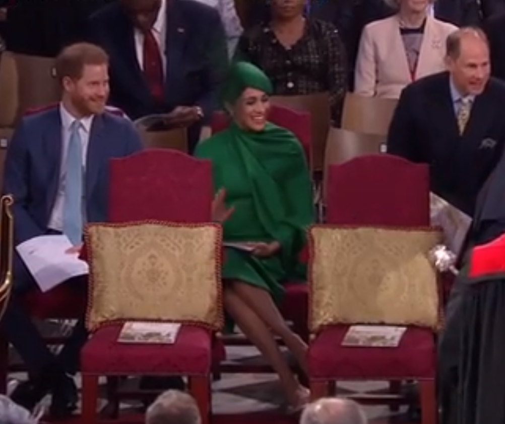 Meghan can be seen giving a small wave to the Cambridges as they arrived at the service