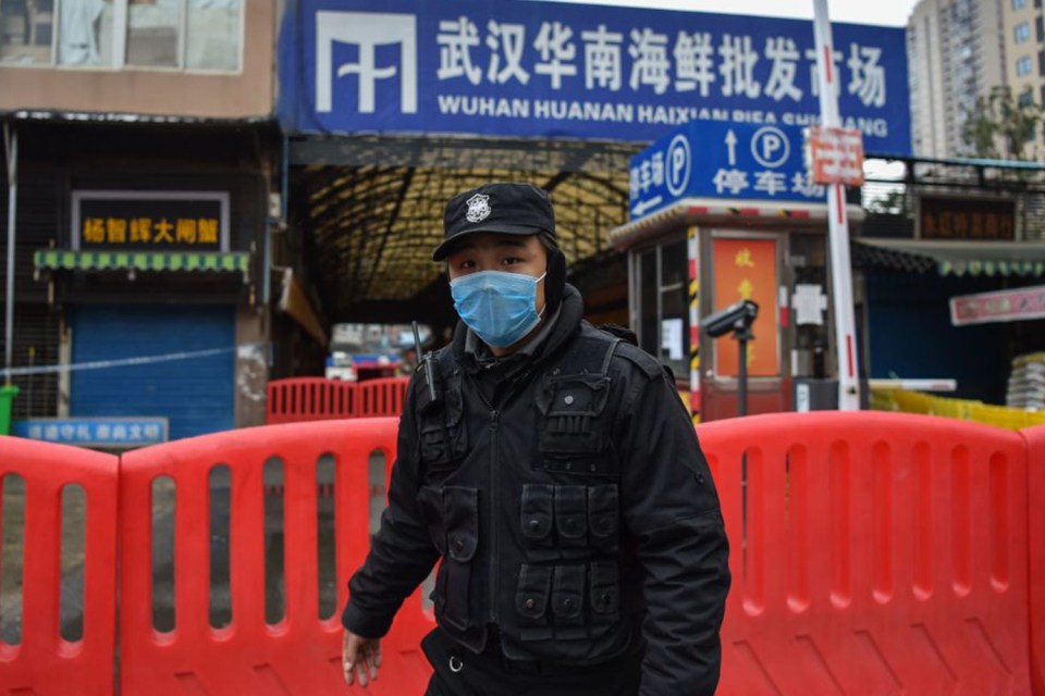  A police officer outside the wet market in Wuhan where coronavirus is believed to have originated