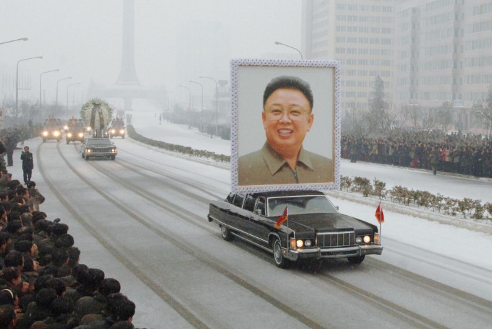  A car carries a portrait of Kim Jong-Il during the funeral procession in Pyongyang (KYODO NEWS/AFP/Getty Images)