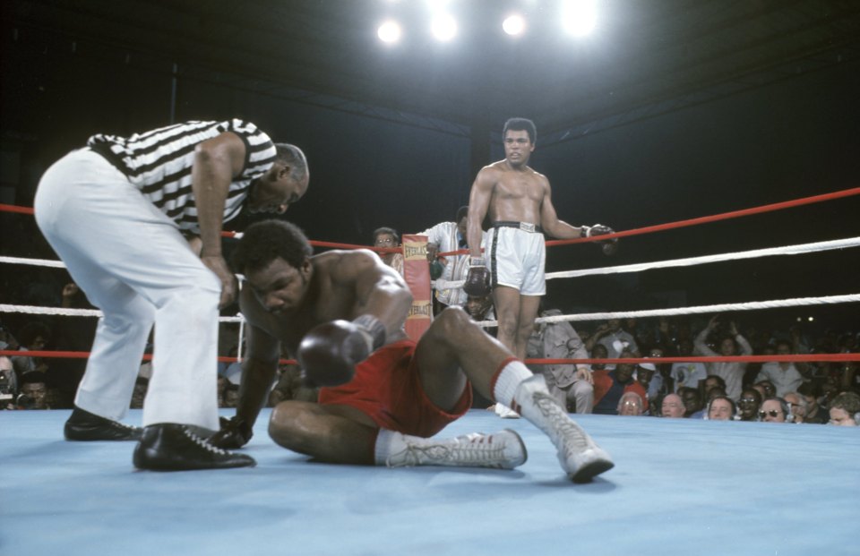  Ali stands over George Foreman in the Rumble in the Jungle