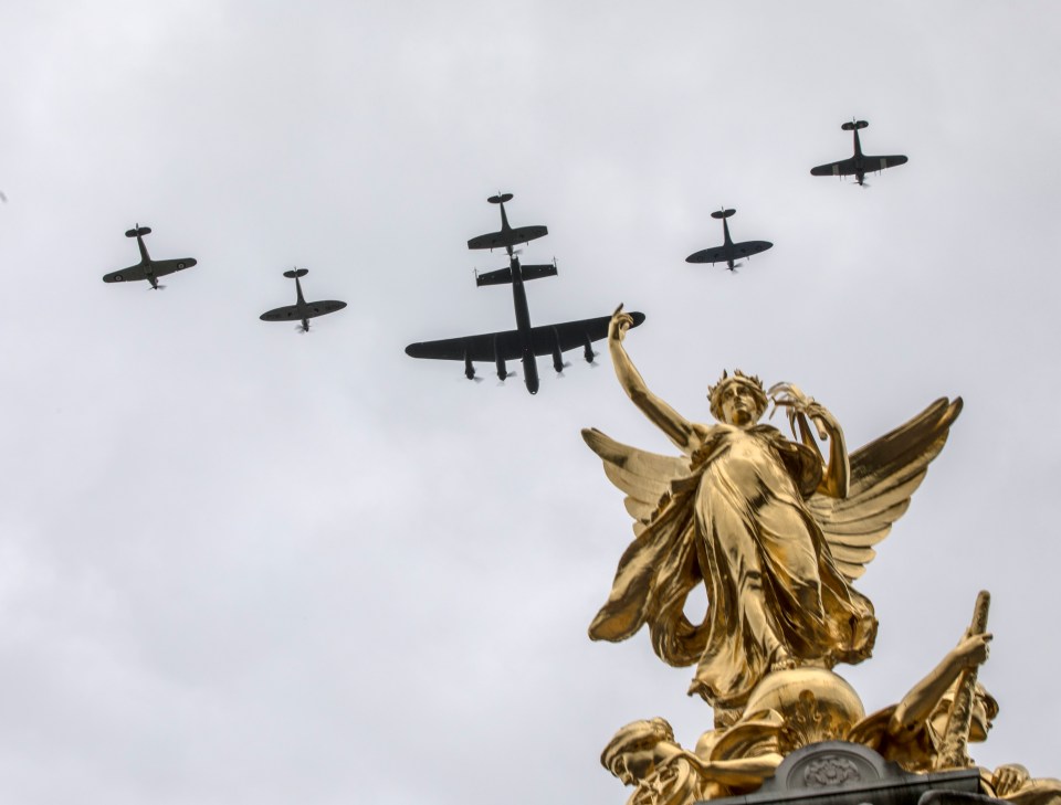  The Battle of Britain Flight flying over the Queen Victoria memorial during the 100 year celebration of the RAF