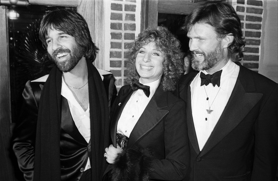 Barbra Streisand and Kris Kristofferson arrive for the premiere of their film A Star Is Born along with producer Jon Peters