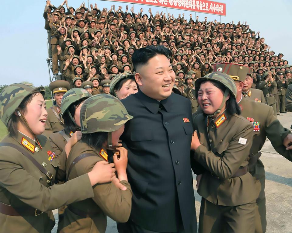  Kim Jong-un with women soldiers from an artillery unit in south-east Kangwon