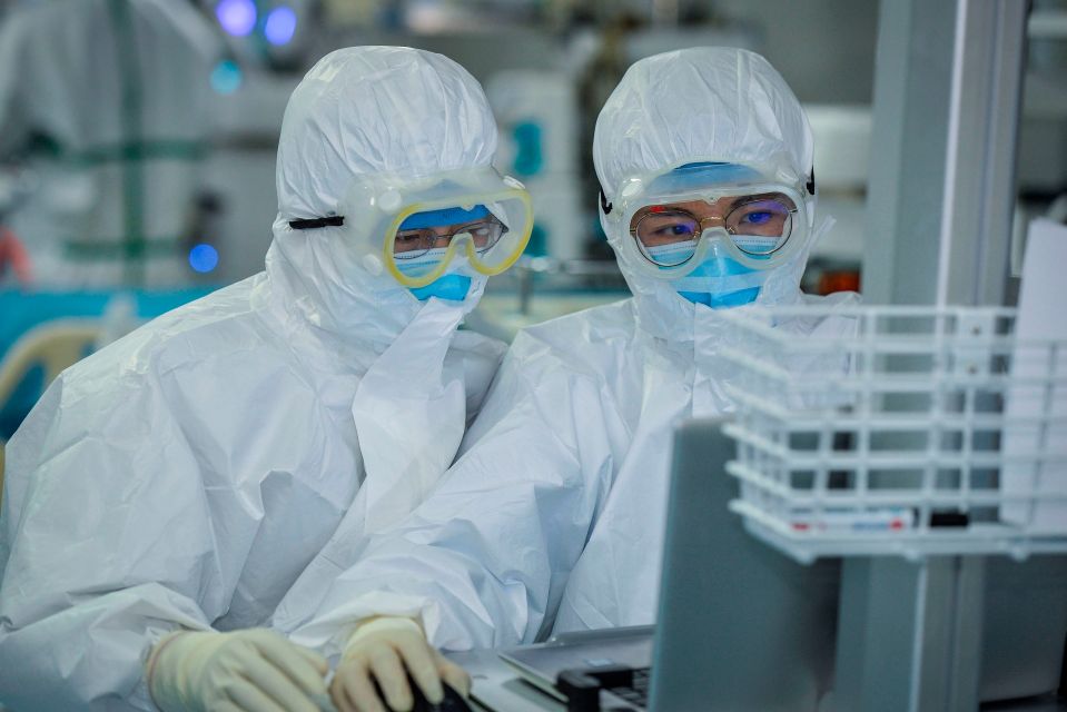  Doctors working as they treat patients infected by the coronavirus at a hospital in Wuhan on February 24