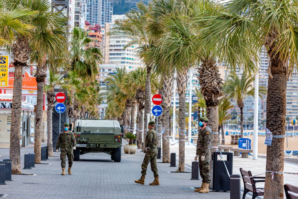 The army patrol the streets of Benidorm, checking that locals aren't leaving the house for non-essential trips