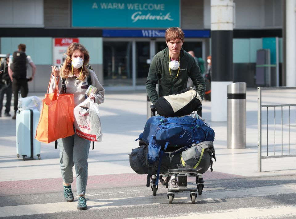 Passengers that travelled on a repatriation flight from Peru arrive at Gatwick Airport 