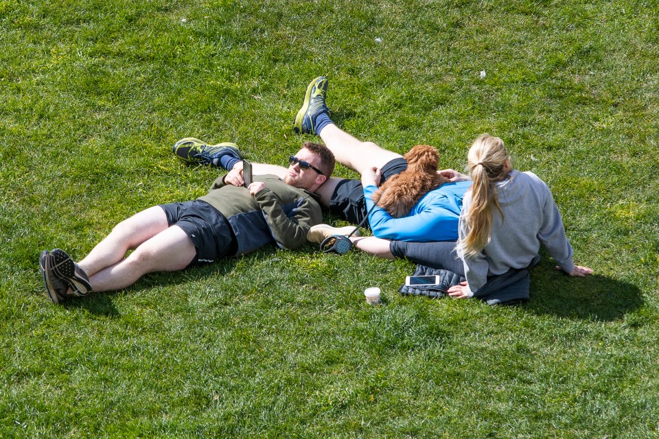 A couple escape for a spot of sunshine today amid the coronavirus lockdown