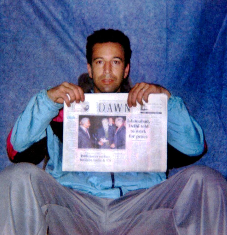  Kidnapped Daniel Pearl was forced to pose with a newspaper