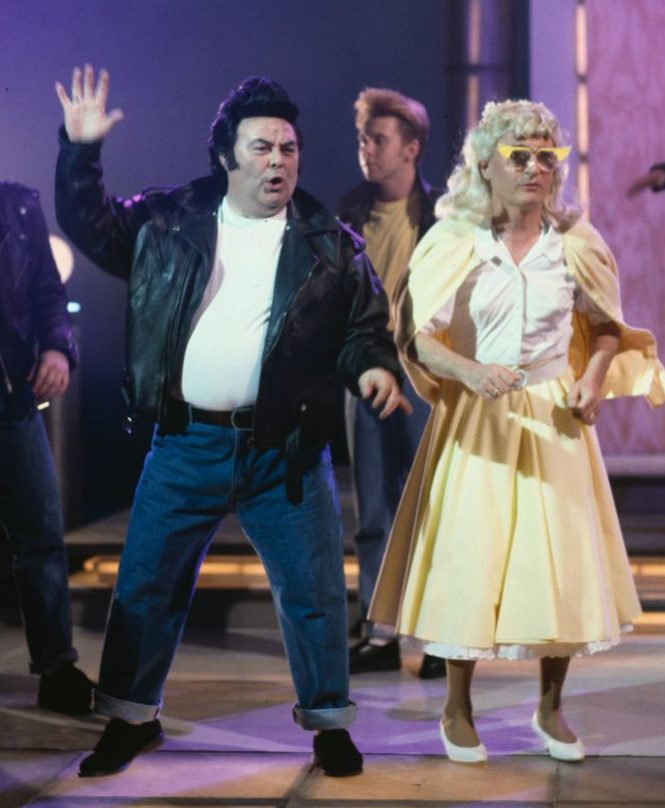  Large and Little performing a scene from the musical 'Grease' as part of a sketch for the television series 'The Little and Large Show' in 1991