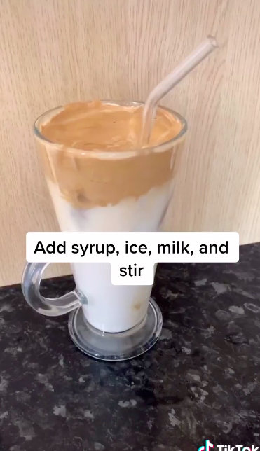  Spoon on top of a glass of milk, with ice being optional