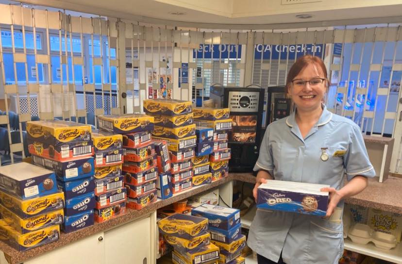  A happy member of staff at West Herts Hospital with treats to feed the exhausted workers