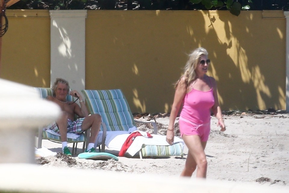  Penny goes for a casual stroll on the beach as Rod watches on