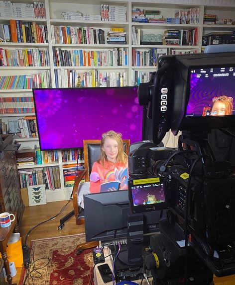  Elise in the family's office, which is lined with bookshelves