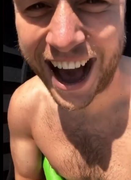  Olly was in hysterics after drenching his girlfriend in water