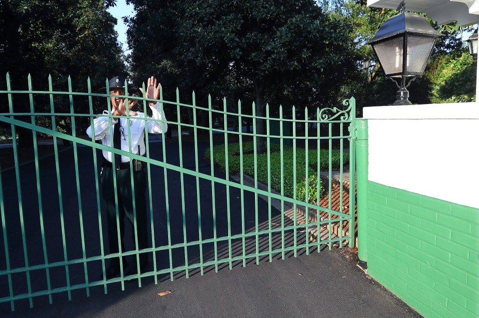  The gates to Augusta National are locked shut and a guard is there to stop people trying to enter