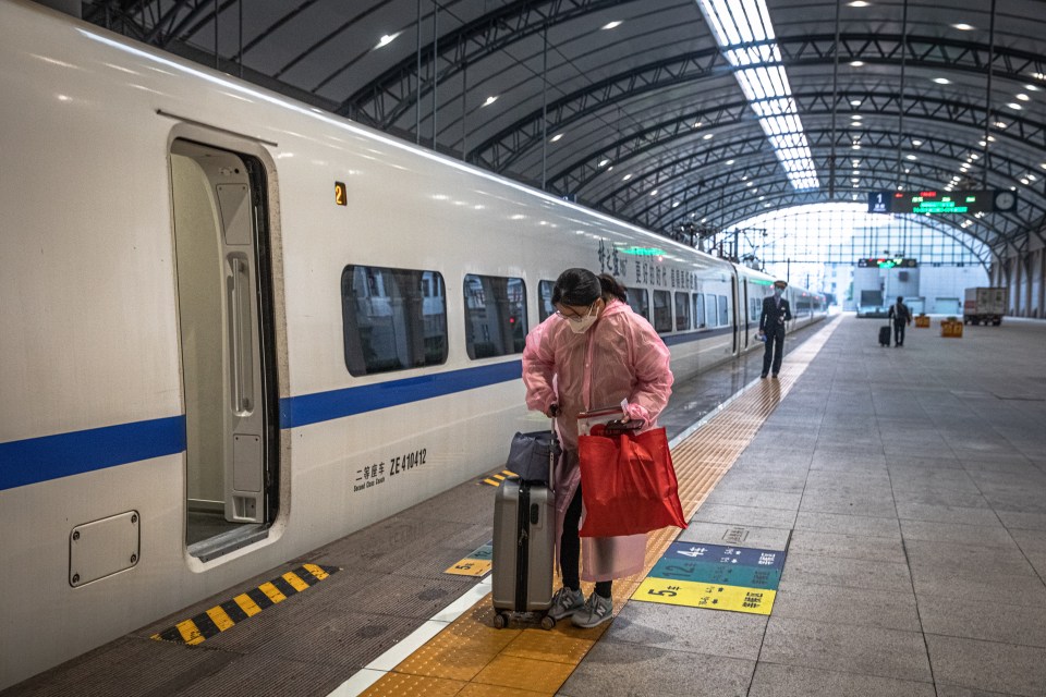  A woman boarding a train at Wuhan station