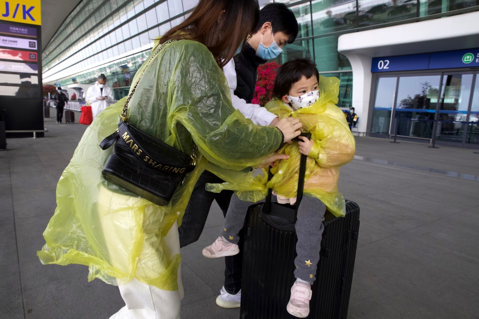  A family arriving at Wuhan's Tianhe airport