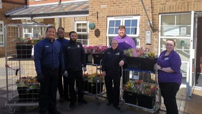  Pictured, at the back, in one of the last photographs taken of him - with his colleagues at the care home