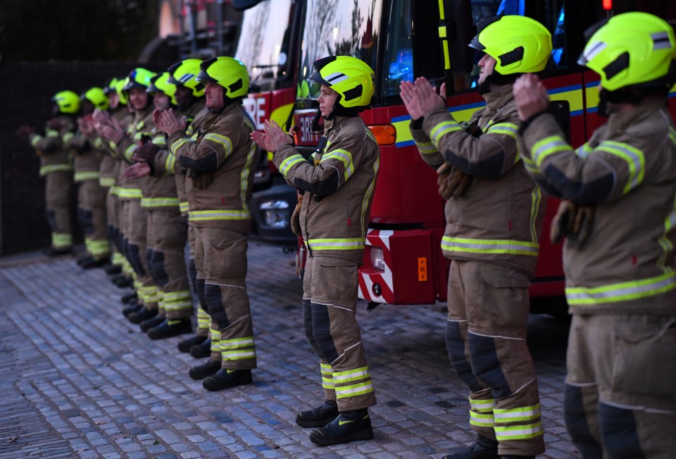  Firefighters applaud outside Clapham Fire Brigade Station