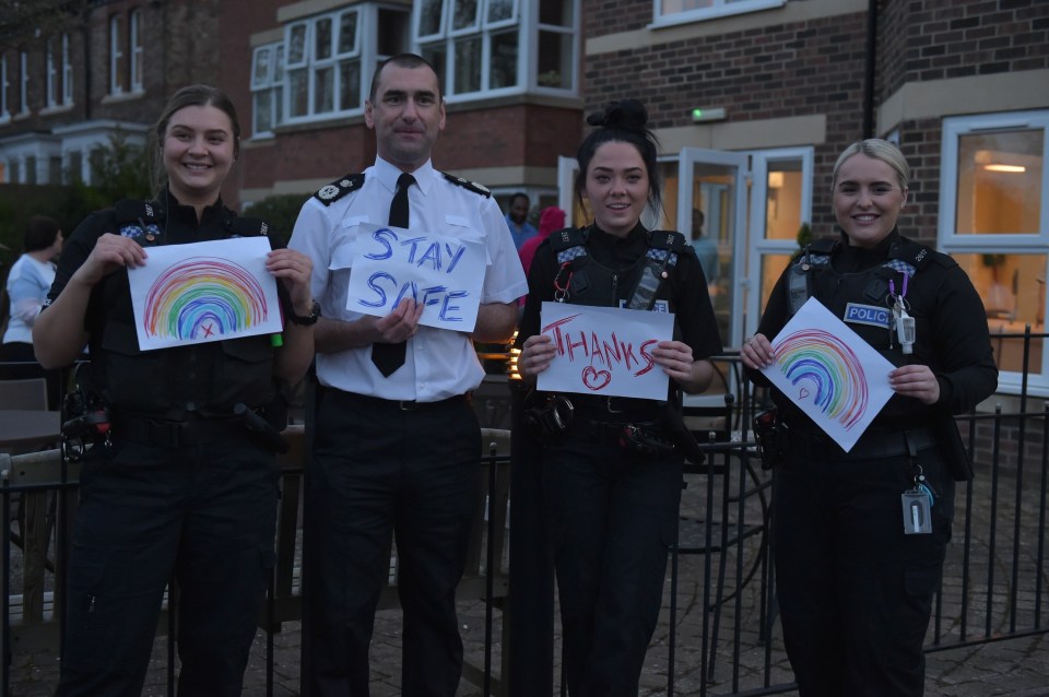  Officers from Cleveland Police stand and clap for carers at Reuben Manor Care Home in Stockton