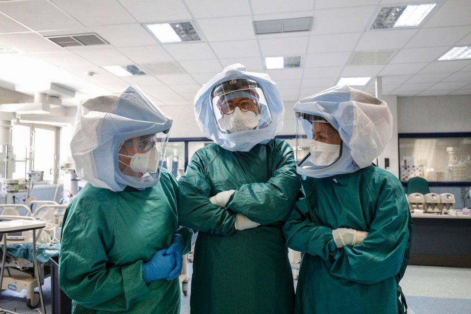  Health care professionals in protective gear pose for a photograph in the intensive care unit at the Policlinico di Tor Vergata hospital, in Rome