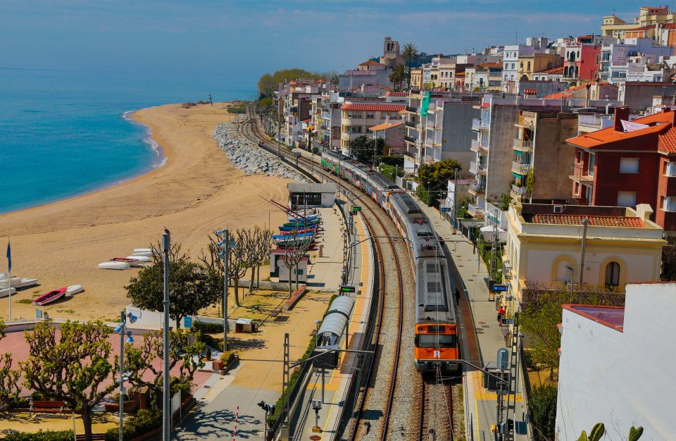  A view of the empty beach and train station on Good Friday in Sant Pol de Mar, Spain