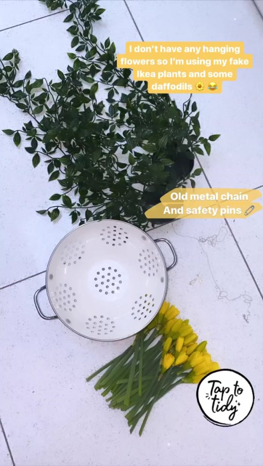 She arranged fake vines and daffodils inside the colander and attached an old metal chain so she could hang it