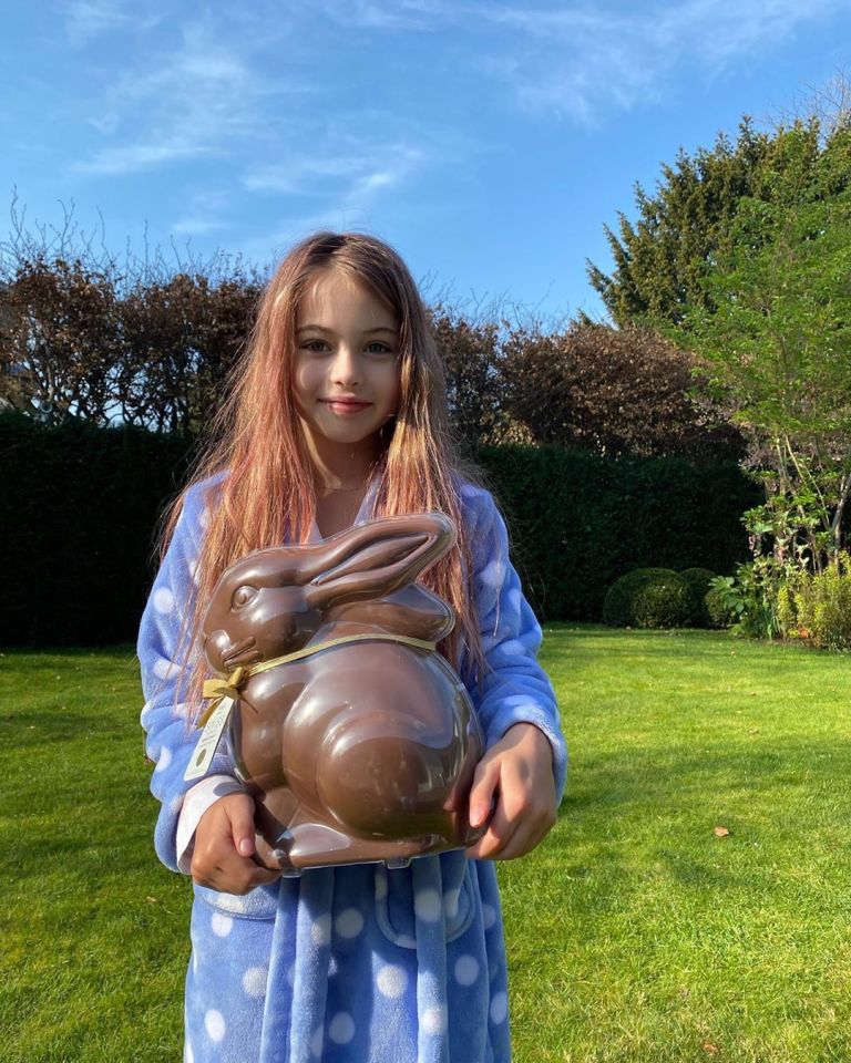  Britain's Got Talent judge Amanda, 49, shared a snap of youngest daughter Hollie, eight, holding a giant chocolate rabbit