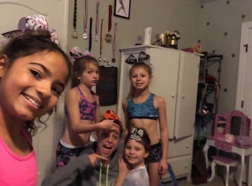  In the kitchen in cheerleader gear is Gracelynn, Kaylynn, Brandy, Jaxson and Kayleigh