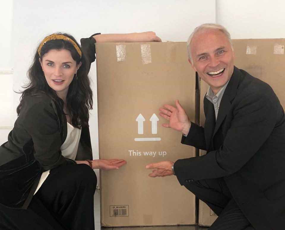 She and Mark Bonnar posed playfully with a cardboard box