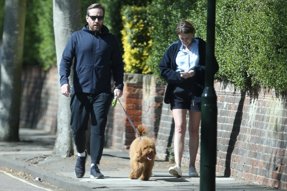  The acting duo on a walk with their pooch