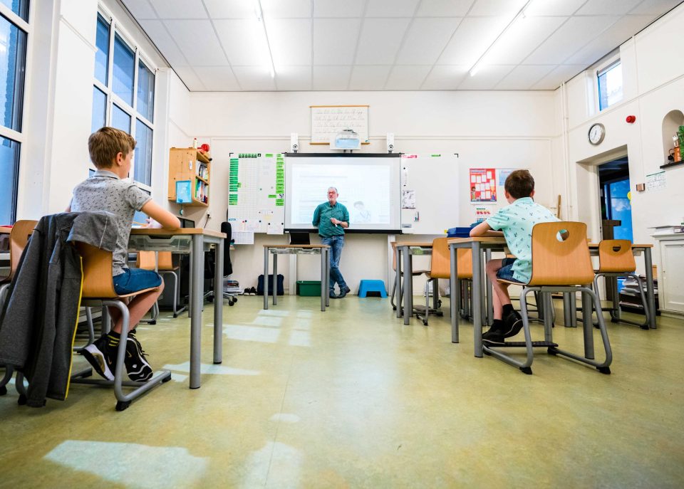 Children attend a school class in Schijndel in Holland