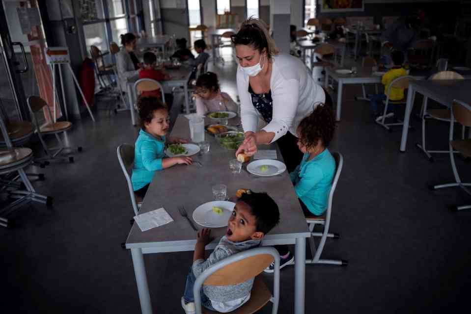 Children sit around a table at a school in Toulouse for the kids of key workers